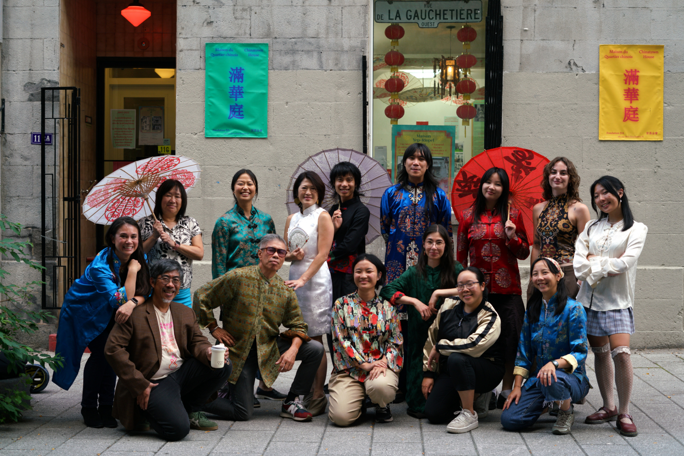 JIA Team Members standing cheerfully in front of Chinatown House